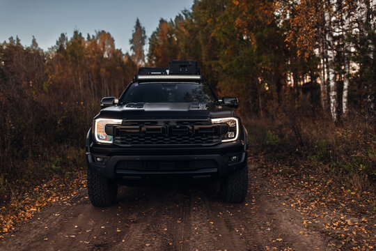 Ford Ranger Raptor at the country road at t he sunset