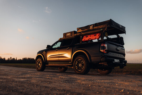 Ford Ranger Raptor at the country road at t he sunset