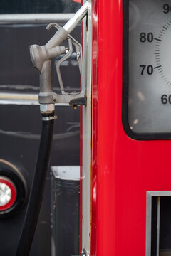 Vintage gas pump with a metal fuel nozzle