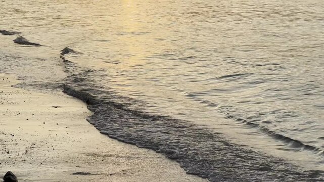Close-up of ocean waves and rocky shoreline in Koh Samui, Thailand