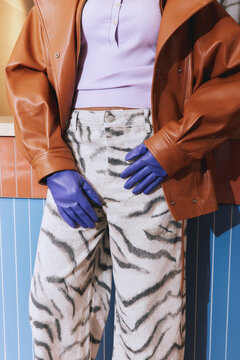 Anonymous woman in bold autumn style clothes