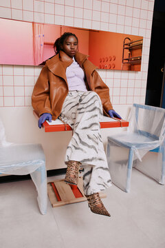 Fashion portrait black woman in modern interior