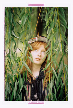 Half-hidden in green &mdash; a dreamy willow portrait