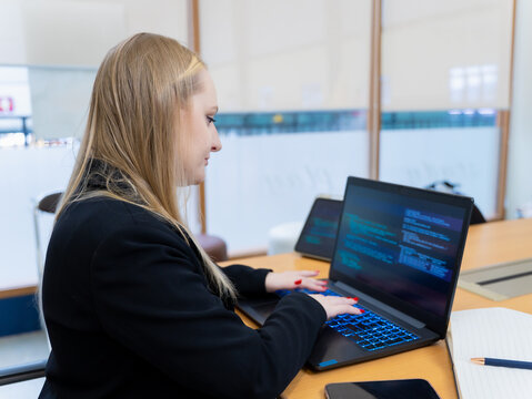 Programmer or IT typing, code cybersecurity or website on laptop at home office for concept verifying code algorithm. Employees woman write code on computer for software development. Remote work.
