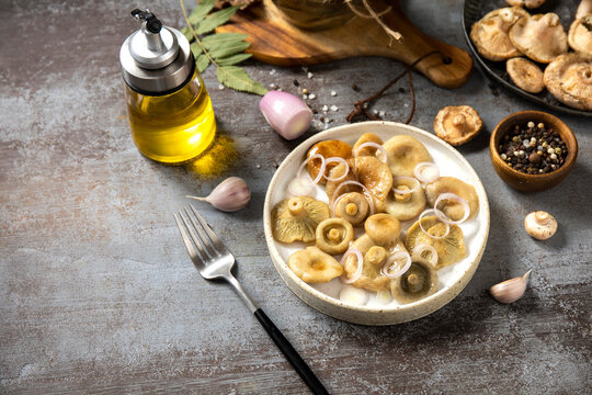 Marinated mushroom salad with onion and olive oil
