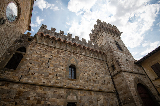 Low angle view of the medieval architecture and fortified tower of the Abbey of San Michele Arcangelo a Passignano in Tuscany, Italy