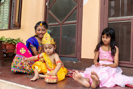 Young children in Hindu festival costume during ceremony