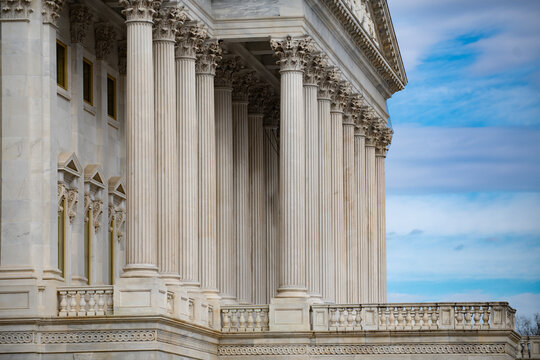 Capitol classical facade. Columns marble repetition texture symmetry. Columns neoclassical architectural layout. Columns decorative capitals ornament Sculpture. Columns heritage exterior structure.
