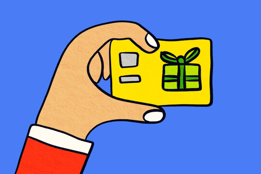 Hand holding festive gift card for Christmas celebration