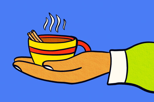 Hand holding steaming festive cup with cinnamon stick