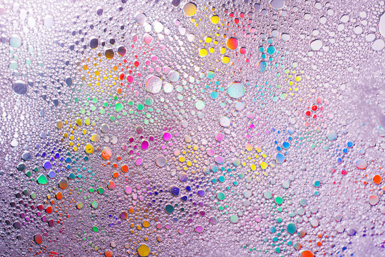 Colorful water droplet abstract texture with rainbow reflections