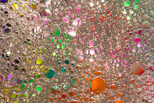 Colorful abstract water droplet texture with iridescent light