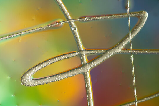 Colorful abstract water droplet pattern on glass surface