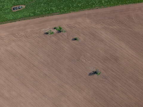 Aerial view of cultivated field with abstract soil patterns