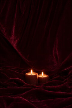 Luxurious Dark Red Velvet Backdrop with Two Candles
