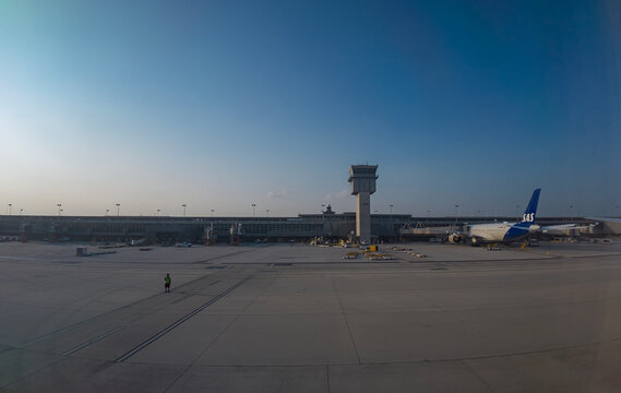 Travel and History: Wide Angle View of SAS Scandinavian Airlines Aircraft and Concourse Control Tower on Tarmac at Washington Dulles International Airport