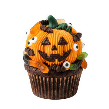 Halloween cupcake decorated with orange frosting shaped like a pumpkin, gummy worms, candy eyes, and bat sprinkles isolated on transparent background