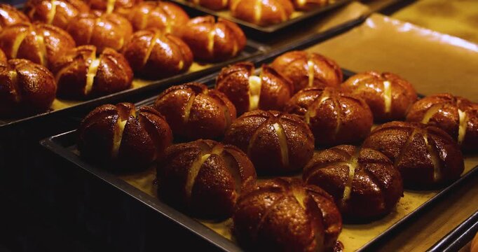 Yukjjok maneul-ppang in Myeongdong, Jung-gu, Seoul, South Korea, Korean garlic bread with cream cheese, freshly baked buns on trays at a bakery and street food stall at a night market