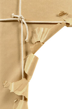 Torn Brown Kraft Paper Parcel Tied with White String Rope Isolated on White Background