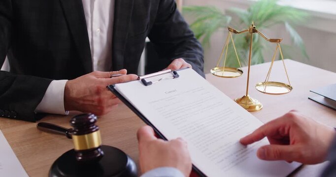 Consulting lawyer, realtor, notary, financial advisor giving consultation, legal advice to client about insurance, wills, house buying or selling, savings, investment, clipboard document paper check 