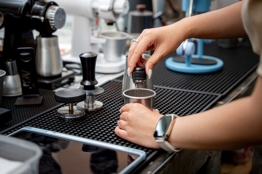 Close up of precise coffee grounds distribution before tamping.