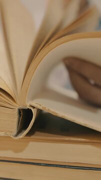 An open book displays its pages clearly, revealing words and texture. The book's edges and spine contribute to its overall composition and feel.