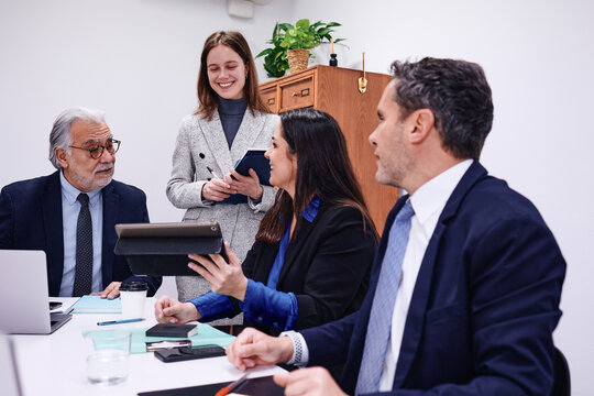 diverse business group of adult people working together and using laptop at office. Successful hispanic Entrepreneurs multigenerational and multicultural teamwork in workplace