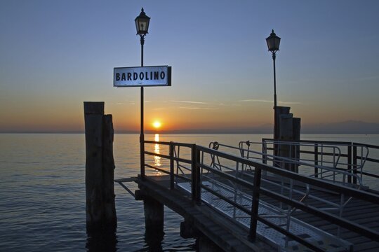 Landing stage, sunset, Bardolino, Lake Garda, Italy