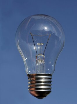 Electric bulb in the blue sky