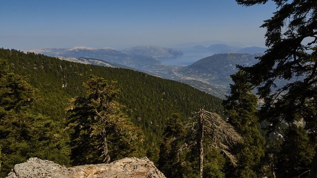 View north, Ithaca, mountains, green hills, blue sky, hazy, Mount Enos, Kefalonia Island, Ionian Islands, Greece