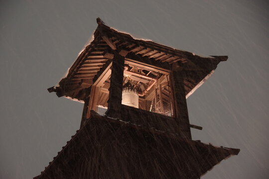 Kawagoe Toki no Kane bell tower lit up at night in the snow