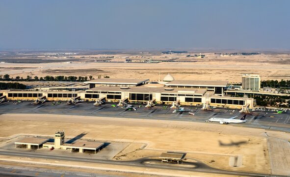 Aerial view of the King Fahd International Airport terminal building and aircraft on the tarmac in Dammam, Saudi Arabia on February 24, 2026.