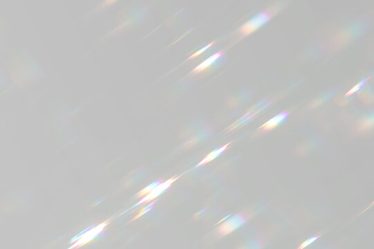 Abstract prism light streaks with chromatic refraction and soft glow effect.