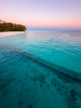 Golden light over the shoreline at Heron Island, Great Barrier Reef, Queensland, Australia.