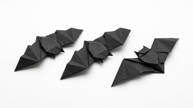 Black origami paper bats trio isolated on transparent background