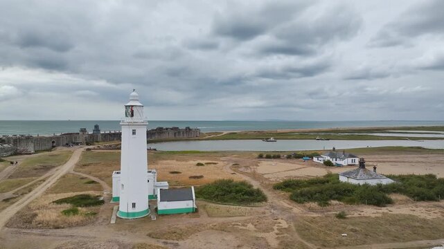 Hurst Point Lighthouse and Hurst Castle from drone over Hurst Spit, Milford on Sea, Lymington, Hampshire, England, United Kingdom