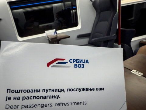 BELGRADE, SERBIA - JULY 19, 2026: Srbija Voz logo printed on a passenger refreshment notice inside a train in Serbia. Srbijavoz is the national passenger railway company of Serbia.