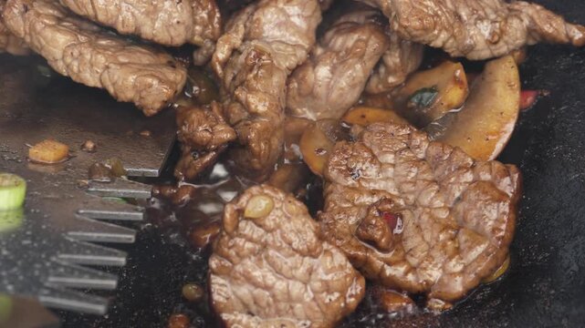 Succulent Grilled Beef Cooking with Vegetables Displayed