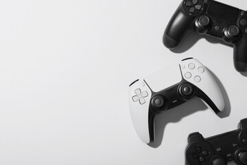 Gaming culture and entertainment, video game controllers on white background for esports competition and digital leisure lifestyle with copy space © Pixel-Shot