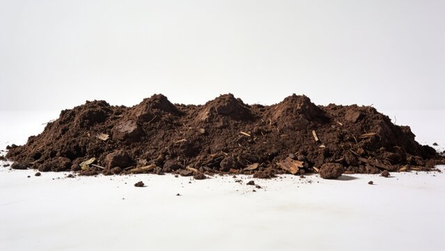 Large Pile of Dark Brown Organic Compost Soil with Rough Earth Texture Isolated on a Clean White Background