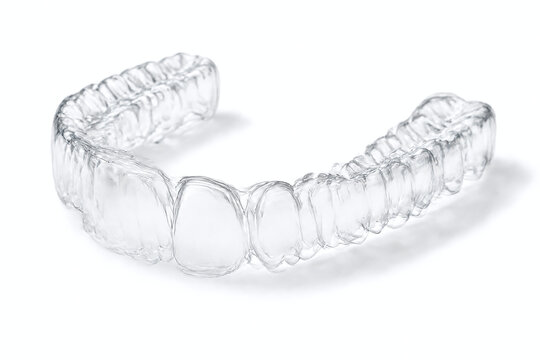 Clear Orthodontic Aligner Tray on White Background