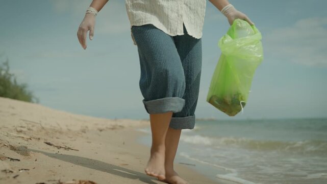 Save water. Volunteer pick up trash garbage at the beach and plastic bottles are difficult decompose prevent harm aquatic life. Earth, Environment, Greening planet, reduce global warming, Save world