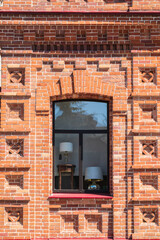The window of the old mansion 19 century with brown bricks wall © Dmitrii Potashkin