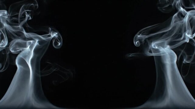 Graceful white smoke plumes rising symmetrically against deep dark background creating mesmerizing visual patterns