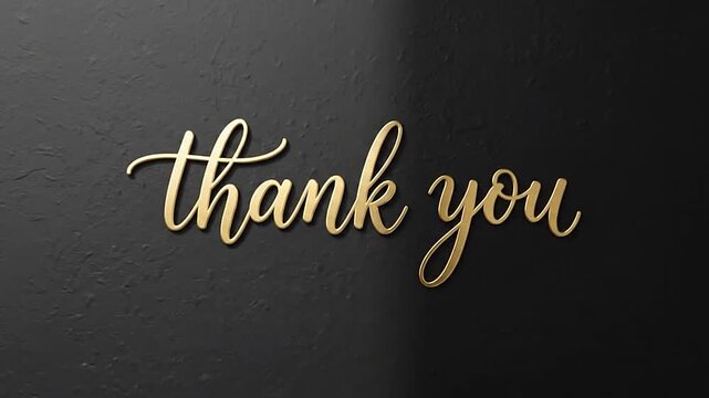 Gold thank you cursive script on a dark textured wall