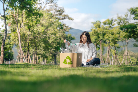Recycle concept. Young woman sorting plastic bottles into a recycling box for environmental awareness, sustainable to zero waste reduction and Reuse.
