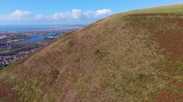 Aerial Reveal of Port Talbot Town Landscape with M4 Motorway and Rows of Residential Houses. Drone Footage of South Wales, UK.
