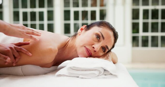 Woman, massage and relax in spa with peace, comfort and rest on towel for stress relief at resort. Hospitality, masseuse and mature person on wellness retreat for skincare, self care and service