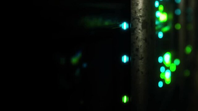 Server room network equipment showing blinking lights and data activity at night