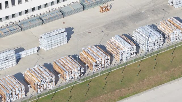 Aerial view of industrial warehouse and metal material storage yard in a factory